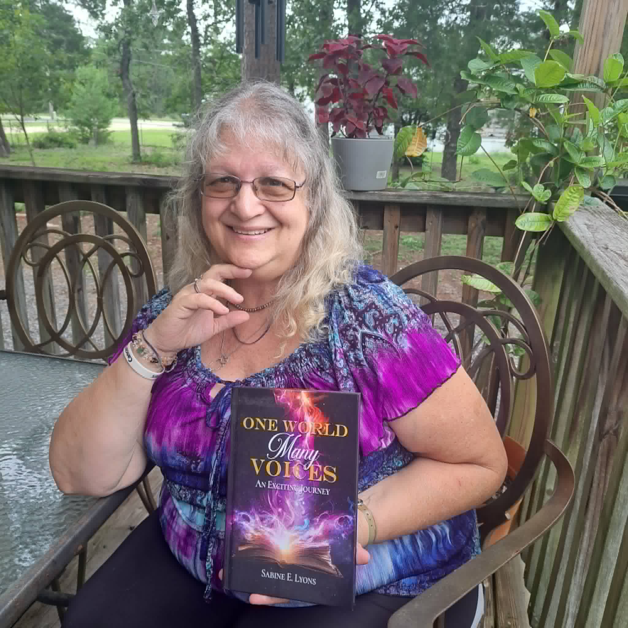 Sabine Lyons with her book "One Word, Many Voices"